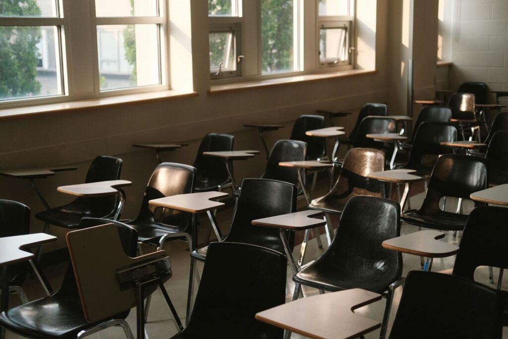 Rows of desks in an empty classroom