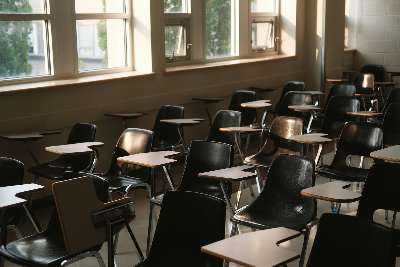 Rows of desks in an empty classroom